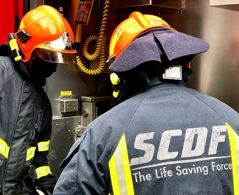 SCDF firefighters with a GoX POD worn at the back of the neck